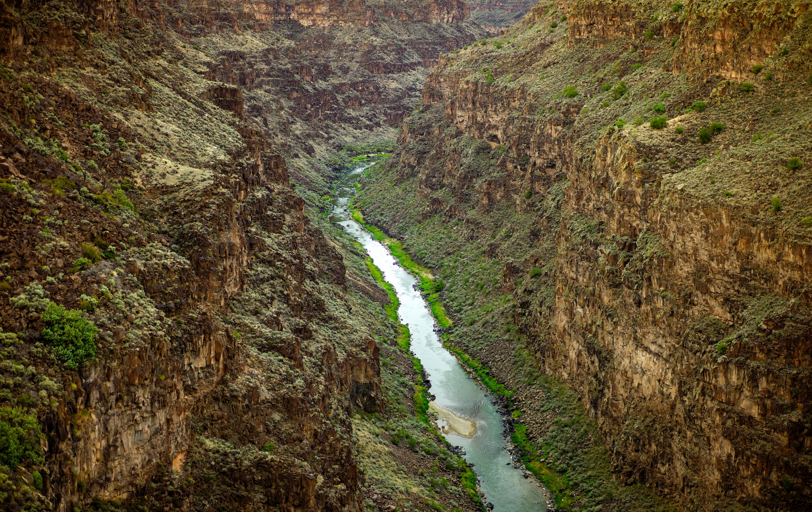Photo by Lightscape river surrounded by mountains from Art Lover's Journey in Taos