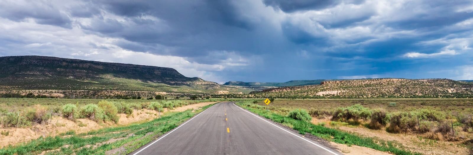 gray asphalt road under white clouds and blue sky during daytime from Road Trip by the Numbers: Albuquerque to Oakland on Slow Down, See More from Road Trip by the Numbers: Albuquerque to Oakland on Slow Down, See More from Road Trip by the Numbers: Albuquerque to Oakland on Slow Down, See More from Road Trip by the Numbers: Albuquerque to Oakland on Slow Down, See More