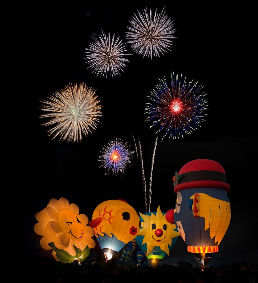 Photo by John Fowler hot air balloons and fireworks display